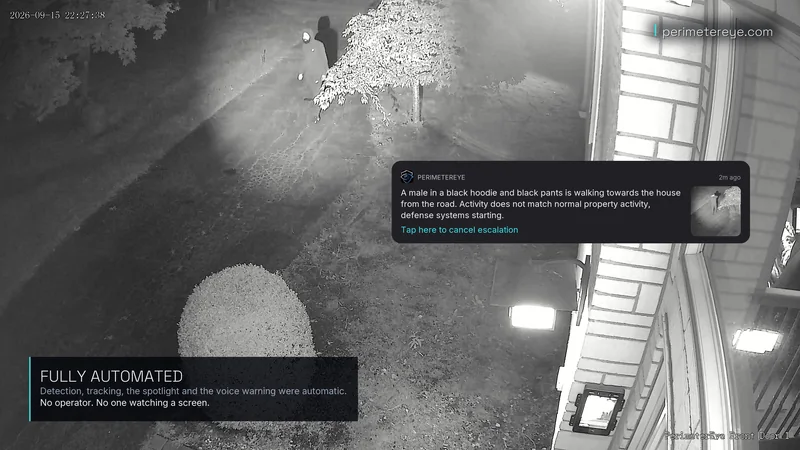 Infrared view of the searchlight beam landing on the person by the tree